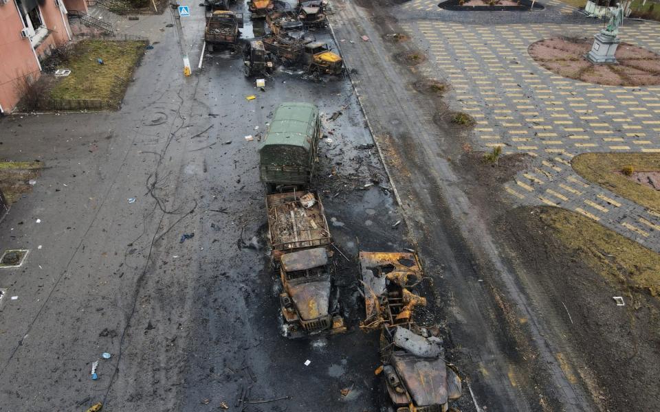Destroyed Russian military vehicles line a street in the settlement of Borodyanka - Maksim Levin/Reuters