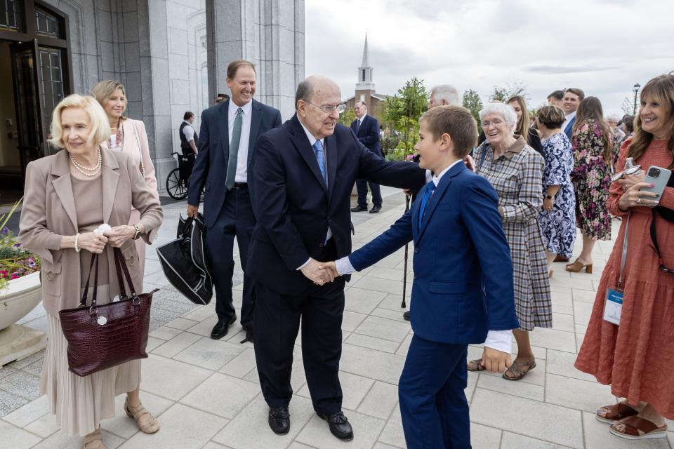 Elder Quentin L. Cook greets Calden Nielsen, 10, after dedicating the Moses Lake Washington Temple on Sept. 17, 2023.