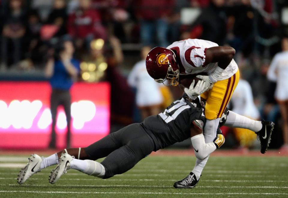 Joseph Lewis (R) is suspended from football activities at USC. (Getty Images)