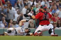 Boston Red Sox's Kevin Plawecki (25) makes the out on New York Yankees' Brett Gardner trying to score on a fielders choice during the sixth inning of a baseball game, Saturday, Sept. 25, 2021, in Boston. (AP Photo/Michael Dwyer)