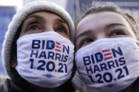 Christine Alverno and her daughter Julia Crump, of Troy, Mich., try to get a glimpse of President-elect Joe Biden as he leaves an early morning church service, in Washington, Wednesday, Jan. 20, 2021. (AP Photo/Jacquelyn Martin)