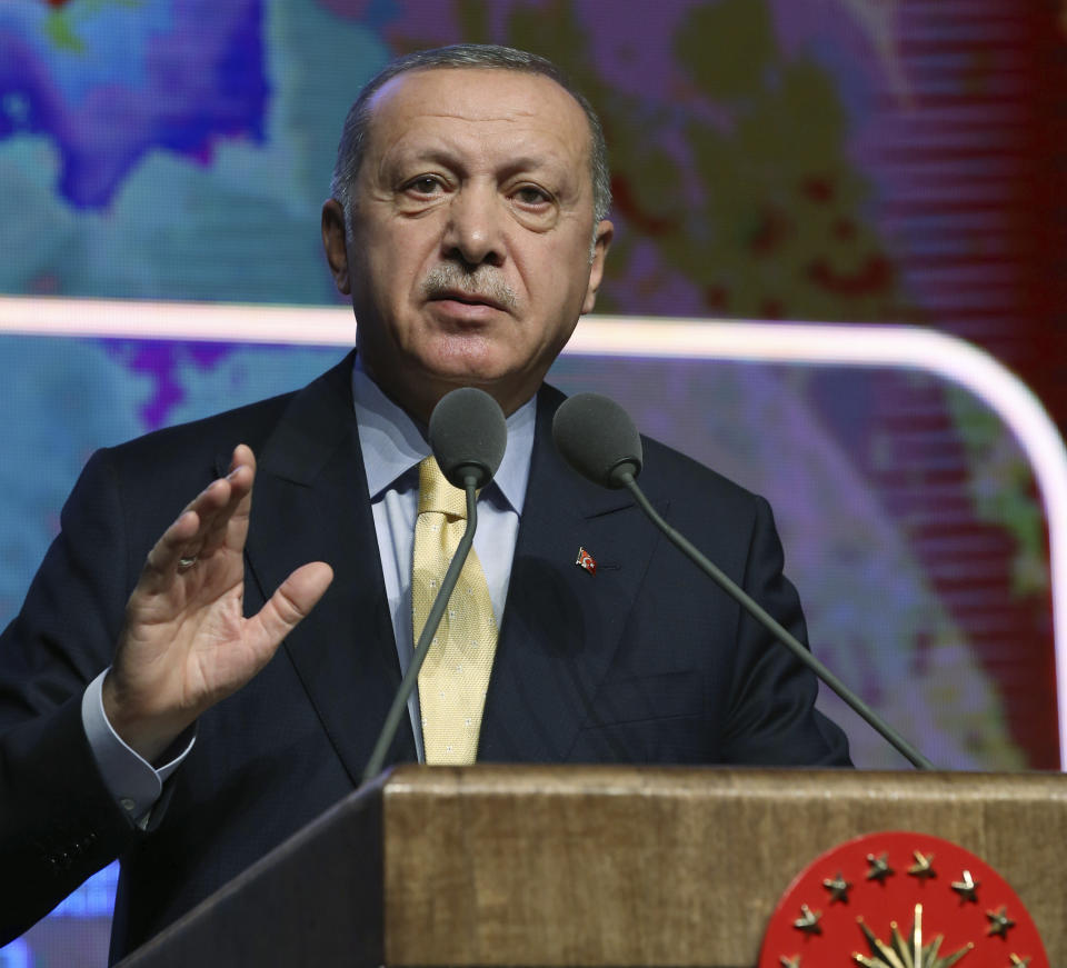 Turkish President Recep Tayyip Erdogan speaks during a meeting in Ankara, Turkey, Wednesday, Nov. 6, 2019. Erdogan says Turkey has captured a wife of the slain leader of the Islamic State group, Abu Bakr al-Baghdadi. Erdogan made the announcement while delivering a speech in Ankara on Wednesday but gave no other details. (Presidential Press Service via AP, Pool)