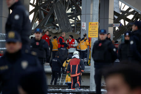 Rescue workers and firemen are seen at the scene of a high speed train crash in Ankara, Turkey December 13, 2018. REUTERS/Tumay Berkin