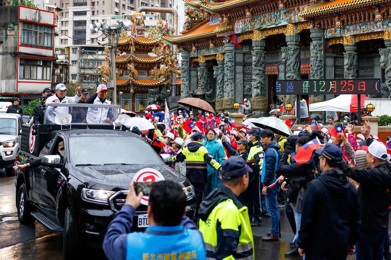 FILE PHOTO: Hou Yu-ih, a candidate for Taiwan's presidency from the main opposition party Kuomintang (KMT) waves to his supporters at campaign event in New Taipei City