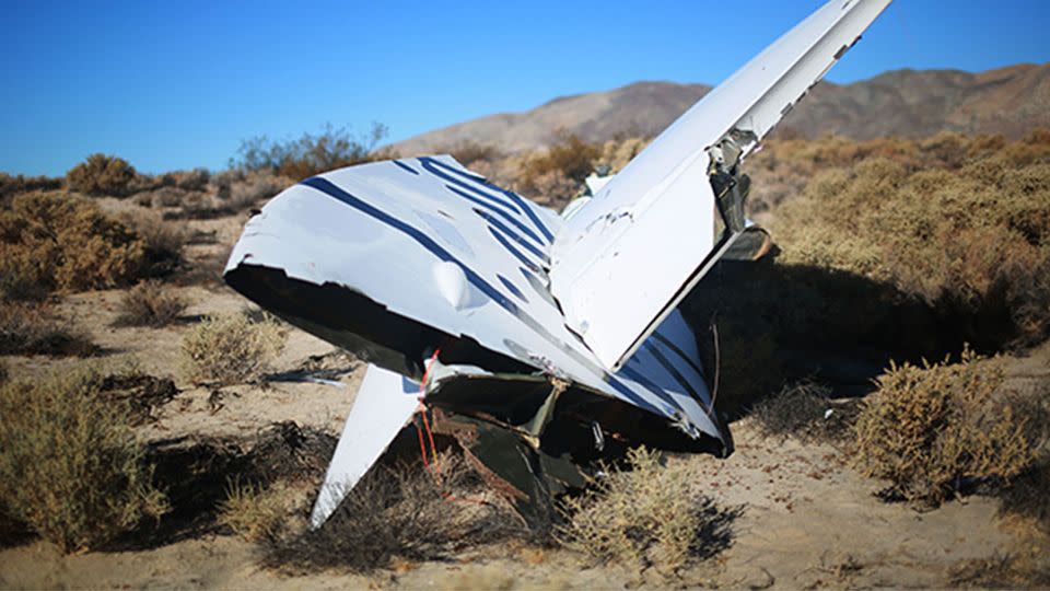 Debris from Virgin Galactic SpaceShipTwo sits in a desert field. Photo: Getty Images