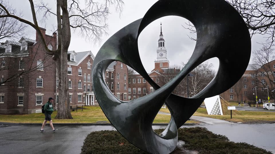 A student walks on the campus of Dartmouth College in Hanover, New Hampshire, on March 5. - Robert F. Bukaty/AP