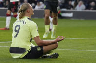 Manchester City's Erling Haaland celebrates after scoring his side's third goal during the English Premier League soccer match between Southampton and Manchester City at St Mary's Stadium in Southampton, England, Saturday, April 8, 2023. (AP Photo/Frank Augstein)