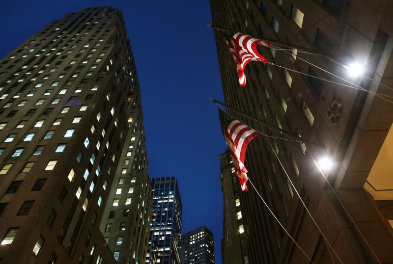 FILE PHOTO: Flags fly outside 85 Broad St., the Goldman Sachs headquarters in New York's financial district