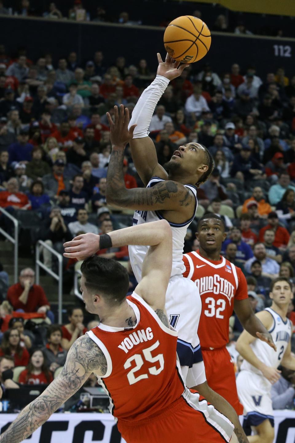 Villanova's Justin Moore shoots against Ohio State's Kyle Young on Sunday.