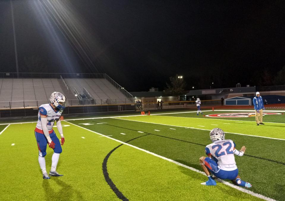 Las Cruces High School's Dalin Walter (left) attempts to practice a field goal kick with Daniel Amaro preparing to hold before the 6A state playoff game against Centennial on Nov. 10, 2023 in Las Cruces.