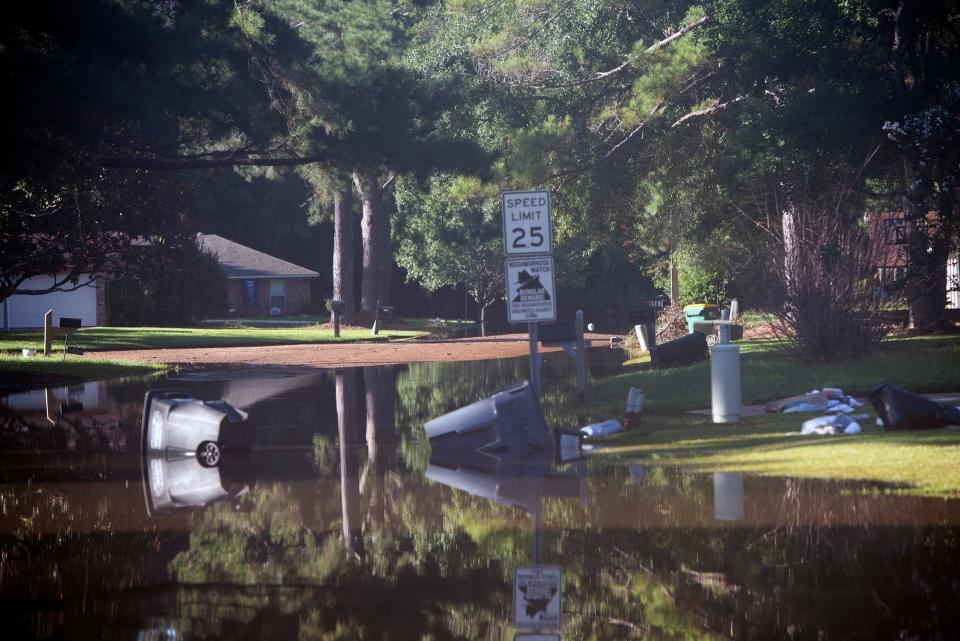 Floodwater covers a section of River Road in Jackson, Miss. Monday, Aug. 29, 2022. After the crest of the Pearl River, some streets but only one house got hit with water in Jackson according to Mayor Chokwe Antar Lumumba.