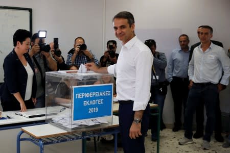 Main opposition New Democracy conservative party leader Kyriakos Mitsotakis casts his vote for the second round of local elections in Athens