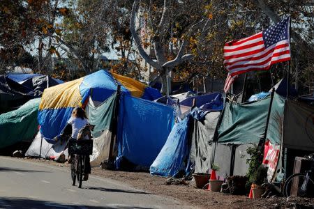City officials have begun what they are calling a slow and methodical clean-up and removal of a large homeless encampment along the Santa Ana River Trail in Anaheim, California, U.S., January 22, 2018. REUTERS/Mike Blake/Files