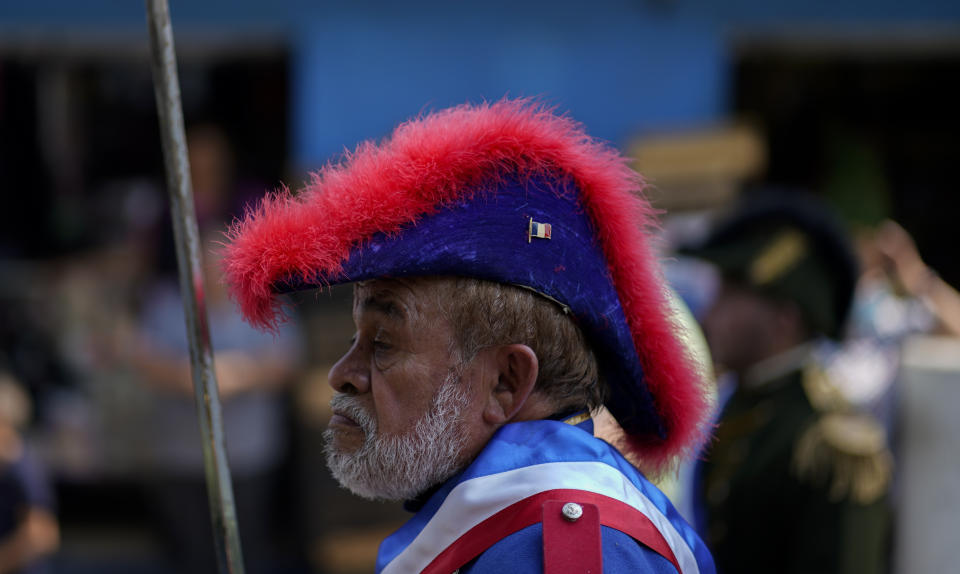 A man plays a French army officer during a re-enactment of The Battle of Puebla as part of Cinco de Mayo celebrations in the Peñon de los Baños neighborhood of Mexico City, Thursday, May 5, 2022. Cinco de Mayo commemorates the victory of an ill-equipped Mexican army over French troops in Puebla on May 5, 1862. (AP Photo/Eduardo Verdugo)