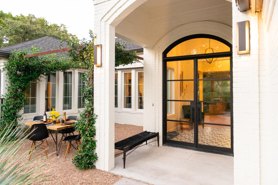 steel pergola in backyard garden by Eden Garden Design