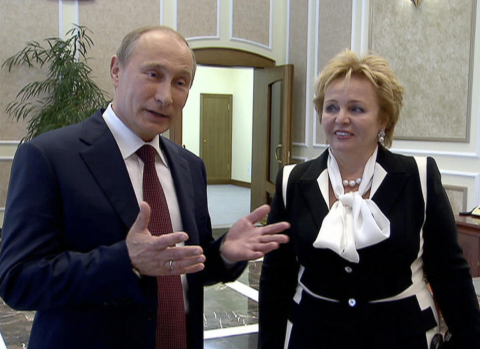 In this grab made from video provided by the Russia24 TV Channel on Thursday, June 6, 2013, Russian President Vladimir Putin, left, and his wife Lyudmila speak to journalists after attending the ballet "La Esmeralda" in the Kremlin Palace in Moscow, Russia. Russian President Vladimir Putin and his wife Lyudmila said Thursday they are divorcing after nearly 30 years of marriage, making the announcement on state television after attending a ballet performance at the Kremlin. (AP Photo/Russia24 via The Associated Press Television News) TV OUT