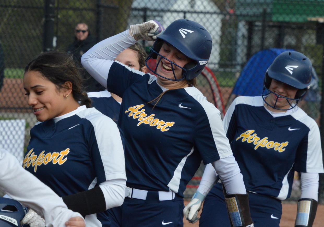 Airport's RaeAnn Drummond celebrates her third home run of the game during a 16-5 win over Flat Rock on Wednesday, April 24, 2024.