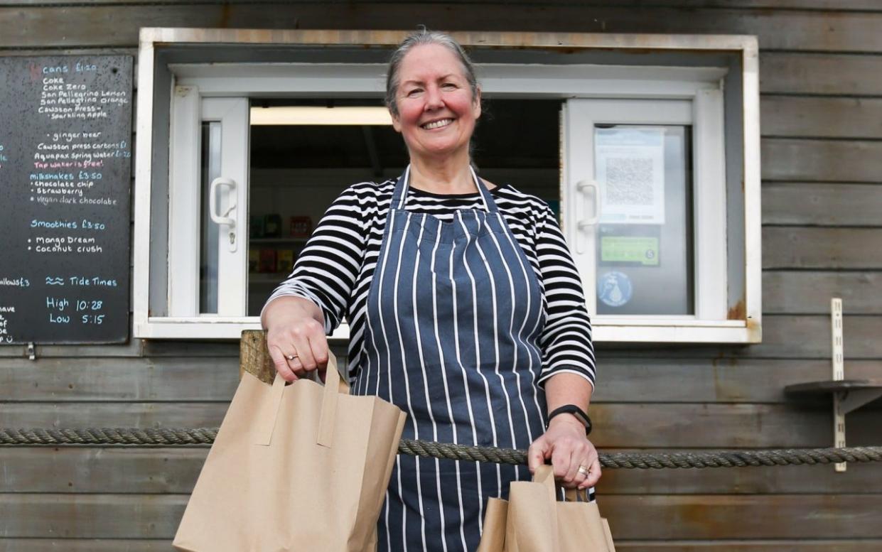 Fiona Crump, owner of the Castle Beach Cafe in Falmouth. she will be making free lunch bags during half term for any child who will normally get a free school lunch - Cameron Smith/PA