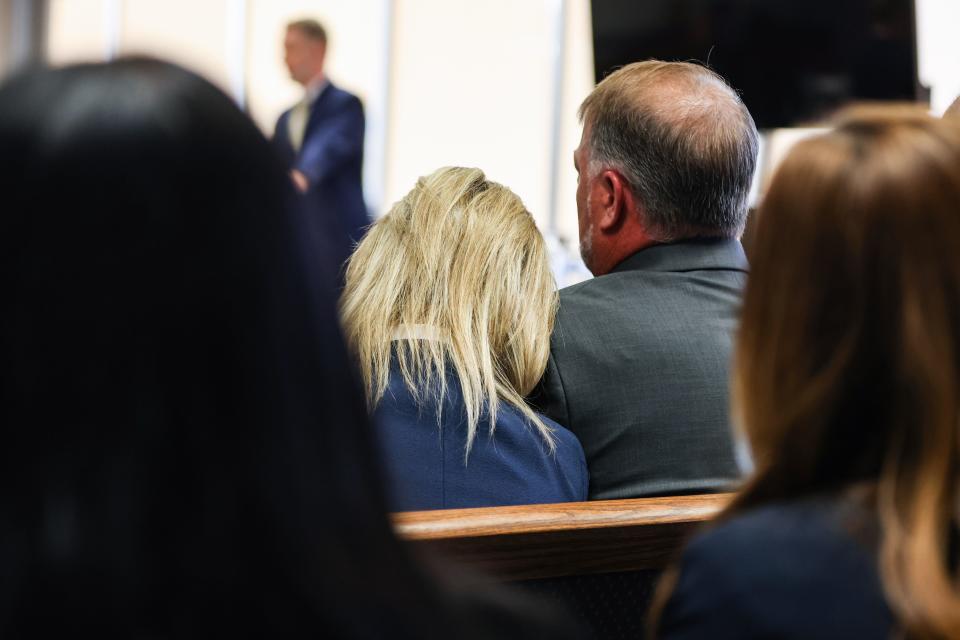 The parents of Stone Foltz, Shari Foltz, left, and Cory Foltz, right, listen during the trial on Tuesday.