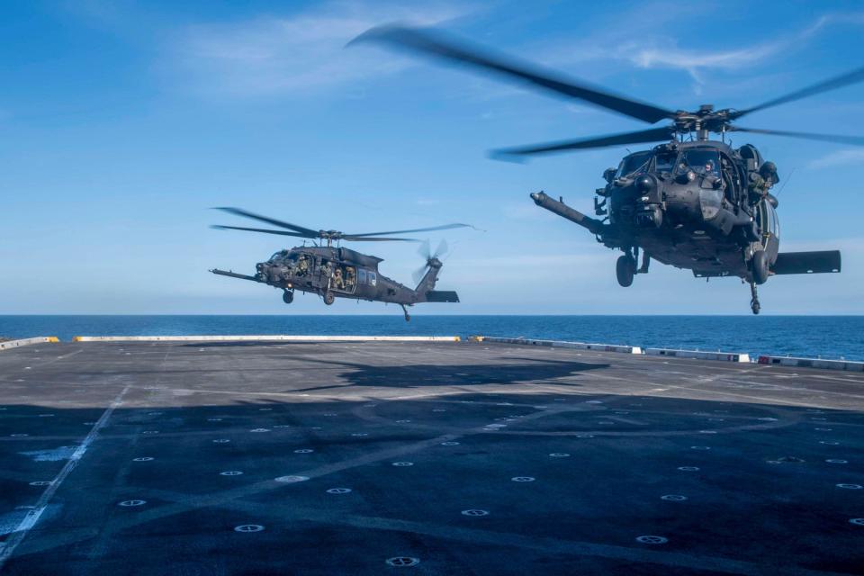 A pair of MH-60Ms land on the U.S. Navy's <u><em>San Antonio</em> class</u> amphibious warship USS <em>John P. Murtha</em>. <em>USN</em>