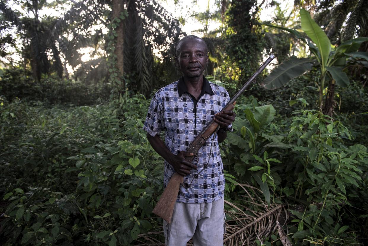 Jean-Marie Pongomoke poses with the gun he uses to hunt antelope outside his village of Salambongo in the Congolese bush. (Photo: Neil Brandvold/DNDi)
