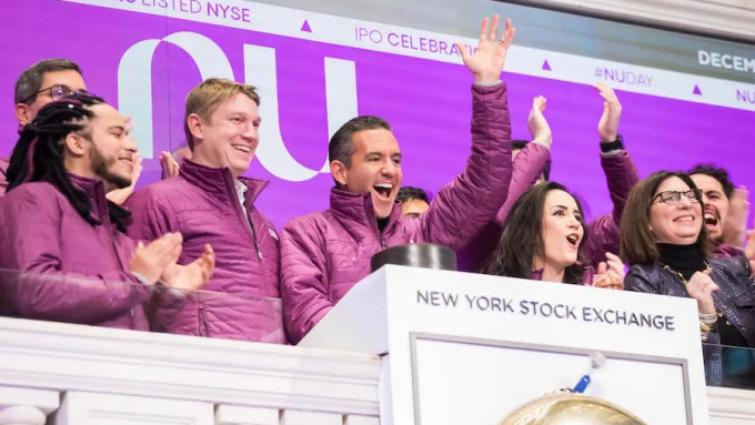 Nubank CEO and co-founder David Vélez and colleagues mark the company's debut on the New York Stock Exchange in December, 2021