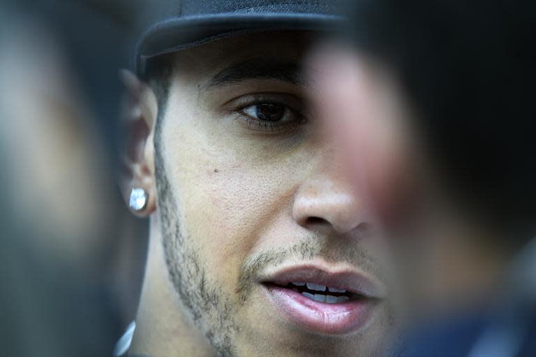 Mercedes AMG Petronas F1 Team's British driver Lewis Hamilton speaks to the press after taking third place in the Monaco Formula One Grand Prix at the Monaco street circuit in Monte-Carlo on May 24, 2015