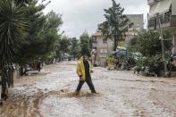 <p>Floods and mudslides have turned roads into fast-flowing rivers after torrential rains struck the west Athenian suburb of Mandra, Greece on Nov. 16, 2017. (Photo: Ayhan Mehmet/Anadolu Agency/Getty Images) </p>