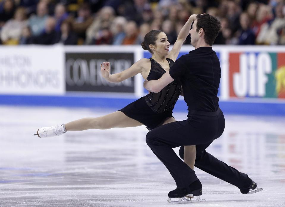 Marissa Castelli and Simon Shnapir skate during the pairs short program at the U.S. Figure Skating Championships Thursday, 9, 2014 in Boston. (AP Photo/Steven Senne)