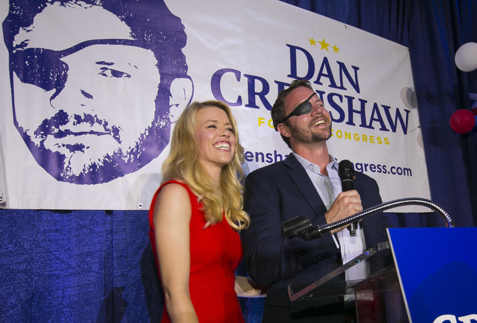 Republican congressional candidate Dan Crenshaw with his wife, Tara, as he delivers a victory speech at an election night party at the Cadillac Bar in Houston on May 22, 2018. Crenshaw was in a runoff with Kevin Roberts for Texas congressional District 2. (Photo: Mark Mulligan/Houston Chronicle via AP)