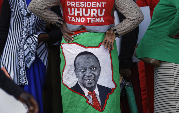 <p>A supporter wears a cloth wrap showing Kenya’s President Uhuru Kenyatta, with writing in Swahili reading “President Uhuru, Five More” referring to the wish for another 5-year term, at an election rally in Uhuru Park in Nairobi, Kenya, Friday, Aug. 4, 2017. (Photo: Ben Curtis/AP) </p>