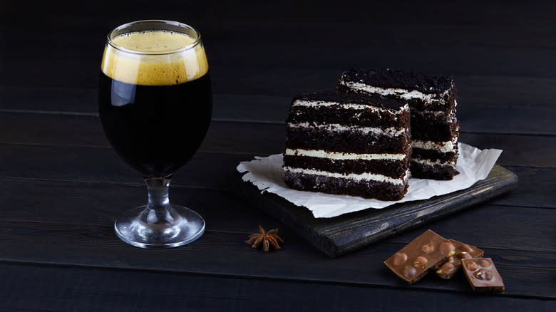 Glass of stout with two slices of cake