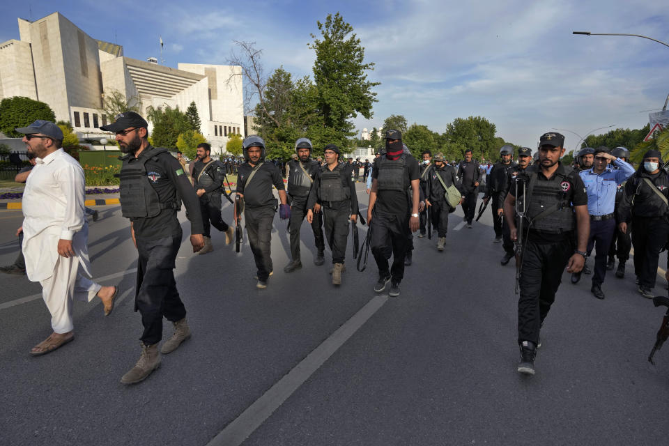 Police commandos patrol outside the Supreme Court, where Pakistan's former Prime Minister Imran Khan is appeared, in Islamabad, Pakistan, Thursday, May 11, 2023. Pakistan’s Supreme Court has ordered the release of Khan, whose arrest earlier this week sparked a wave of violence across the country by his supporters. (AP Photo/Anjum Naveed)
