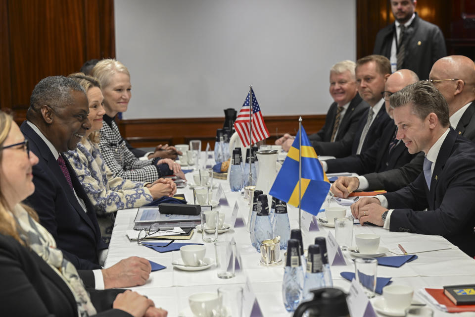 Sweden's Defence Minister, Pal Jonson, right, and US Secretary of Defense, Lloyd Austin, left, at the Musko Naval Base, in Stockholm, Sweden, Wednesday, April 19, 2023 for a bilateral meeting. (Fredrik Sandberg/TT News Agency via AP)