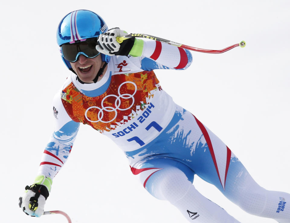 Austria's Matthias Mayer finishes the men's downhill at the Sochi 2014 Winter Olympics, Sunday, Feb. 9, 2014, in Krasnaya Polyana, Russia. (AP Photo/Christophe Ena)