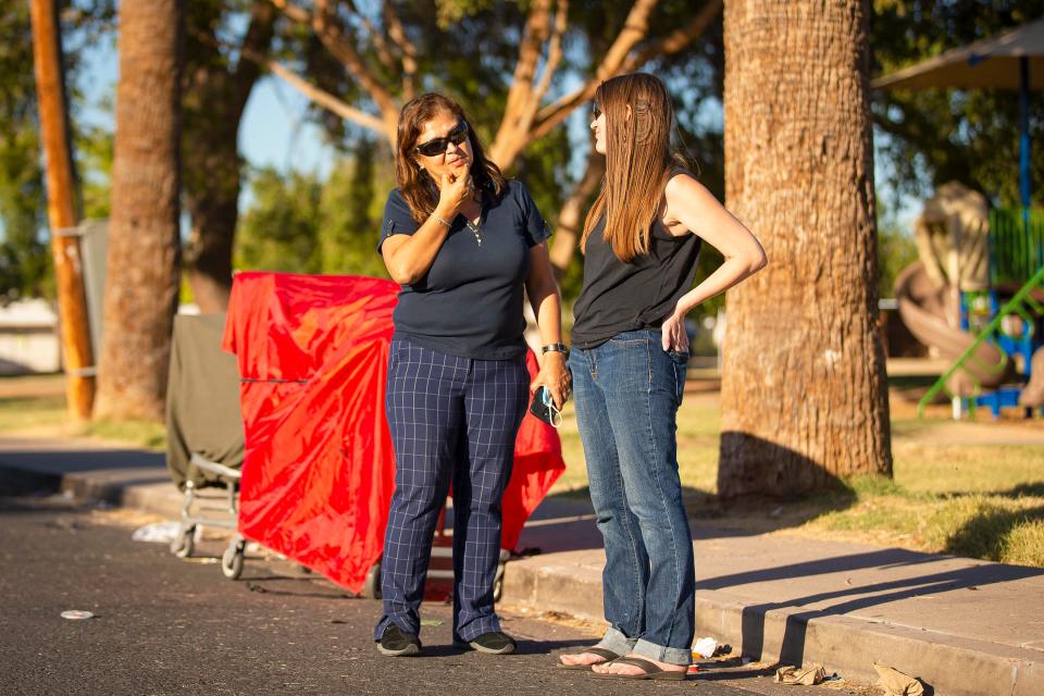 Lilia Rubio (left, seen with neighbor Morgan Sailor at Perry Park in central Phoenix) has long asked the city of Phoenix for a dedicated team of employees to work specifically with the neighborhood to address encampments.