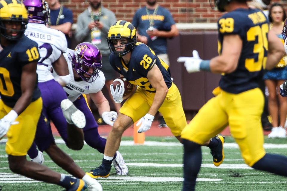 Michigan punt returner Jake Thaw runs against East Carolina during the second half of U-M's 30-3 win on Saturday, Sept. 2, 2023, at Michigan Stadium.