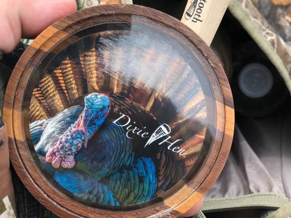 nancy jo adams showng her pot call for turkey hunting