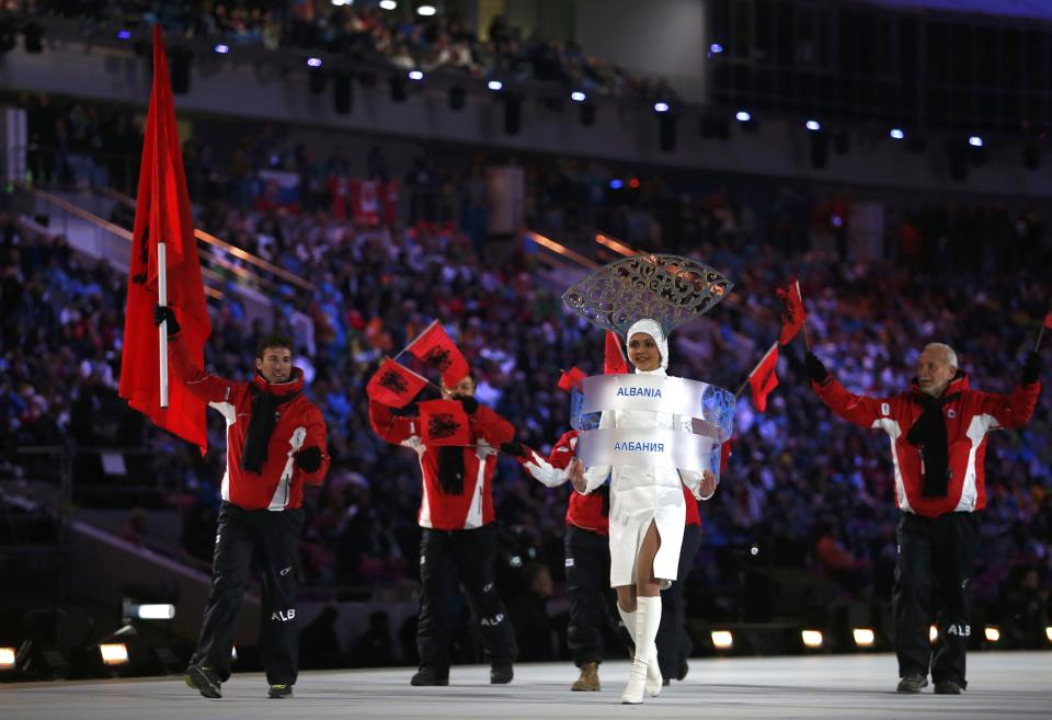 Albania's flag-bearer Erjon Tola leads his delegation as they march in during the opening ceremony of the 2014 Sochi Winter Olympics, February 7, 2014. REUTERS/Jim Young (RUSSIA - Tags: OLYMPICS SPORT)