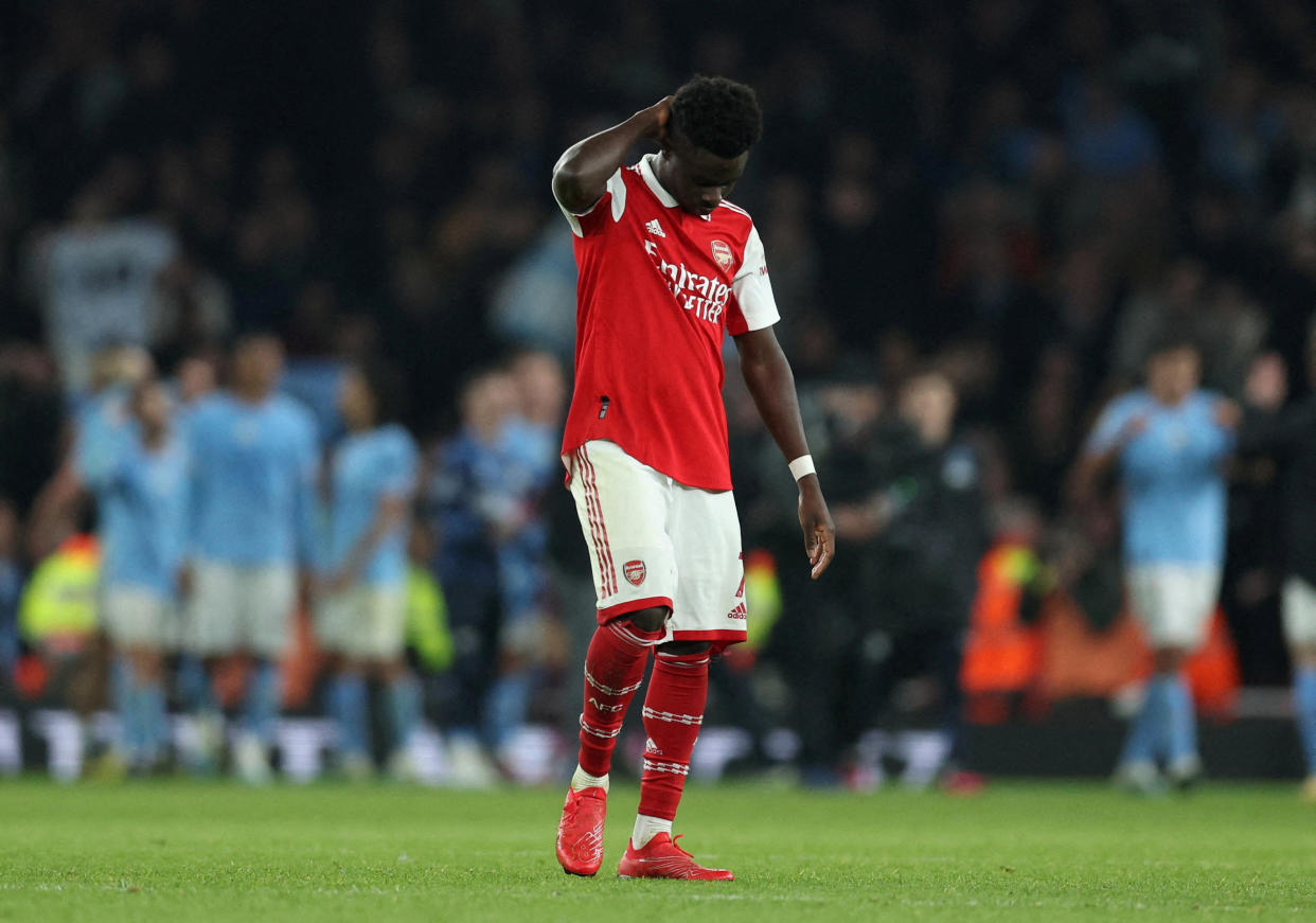 Arsenal's Bukayo Saka looks dejected after the Gunners lost their English Premier League match against Manchester City.