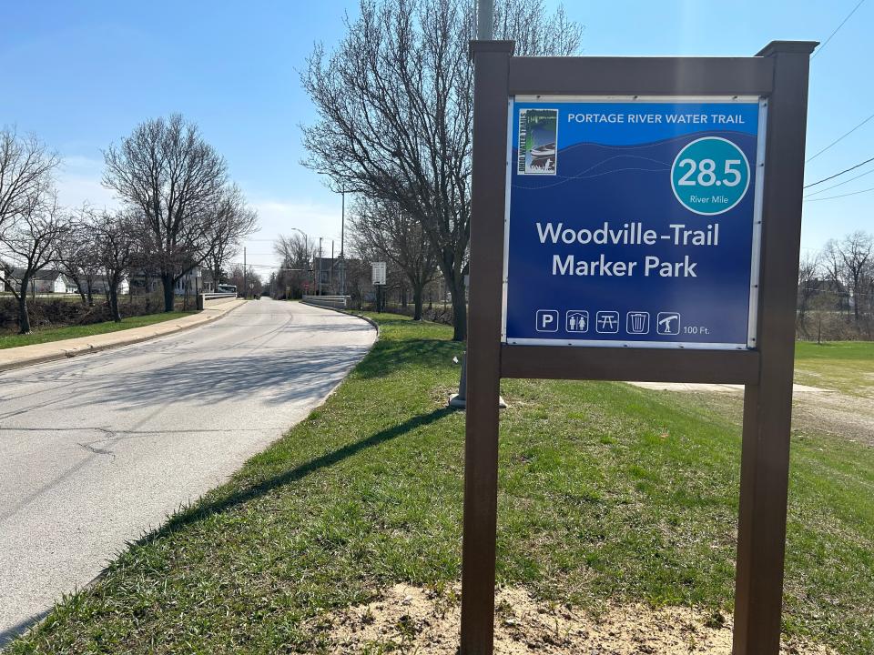 A shiny new blue sign at Trail Marker Park is part of the recently designated Portage River Water Trail, and indicates the park is an access point.