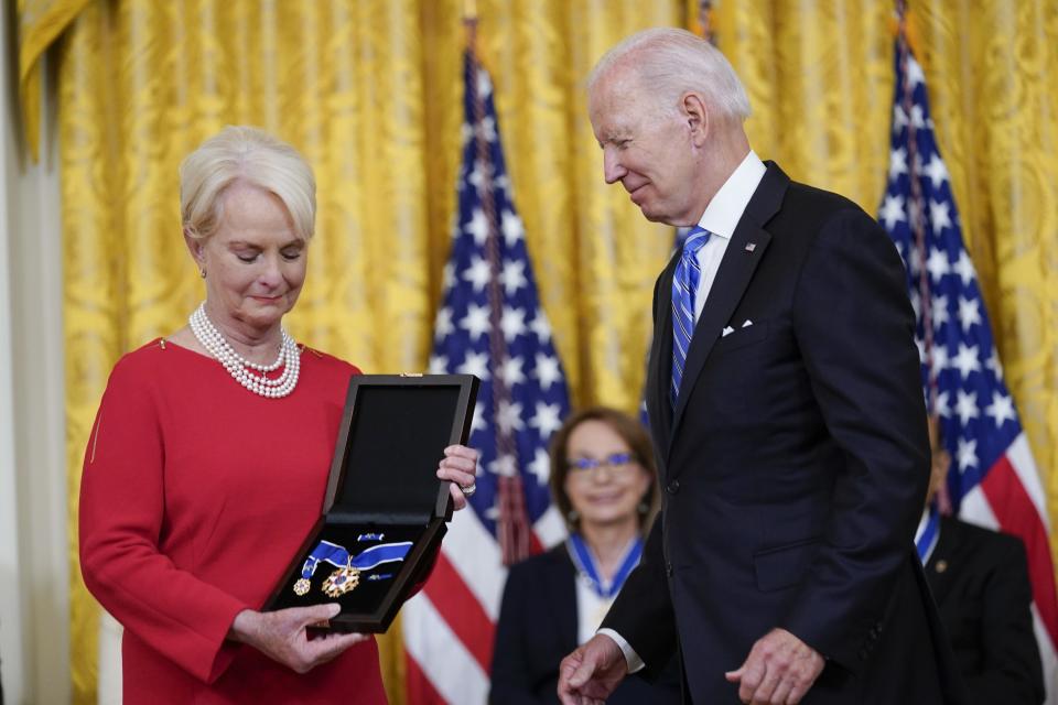 President Joe Biden posthumously awards the nation's highest civilian honor, the Presidential Medal of Freedom, to Sen. John McCain of Arizona as his wife Cindy McCain accepts the award during a ceremony in the East Room of the White House in Washington, Thursday, July 7, 2022.