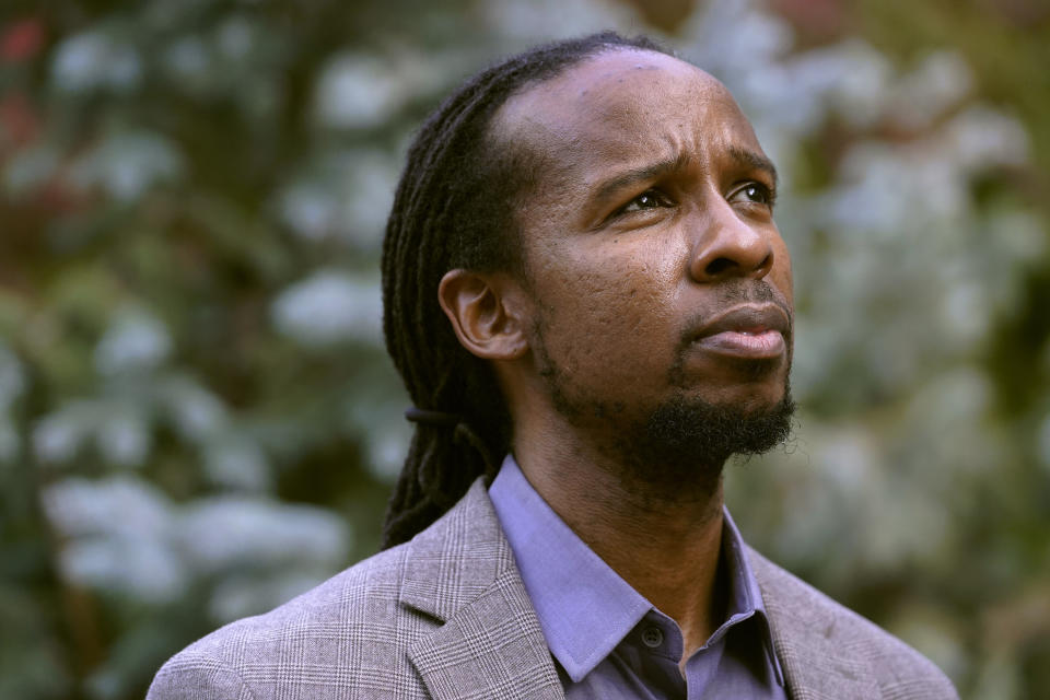 FILE - In this Oct. 21, 2021, file photo, Ibram X. Kendi, director of Boston University's Center for Antiracist Research, stands for a portrait in Boston. Racism, COVID-19 and other big issues of the day figure prominently in the work of many of the 25 recipients of this year's John D. and Catherine T. MacArthur Foundation's "genius grants," announced Tuesday, Sept. 28, 2021. The group includes Ibram X. Kendi, the best selling author of "How to be an Antiracist." (AP Photo/Steven Senne, File)