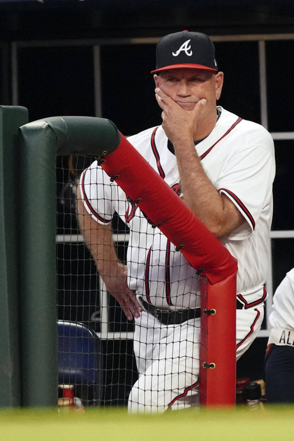 Atlanta Braves manager Brian Snitker (43) watches from the dugout during a baseball game against the Boston Red Sox Tuesday, May 10, 2022, in Atlanta. (AP Photo/John Bazemore)