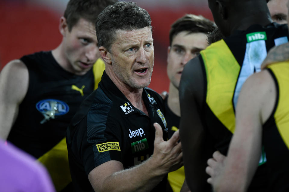 Head coach Damien Hardwick of the Tigers speaks to his players during the round 7 AFL match.