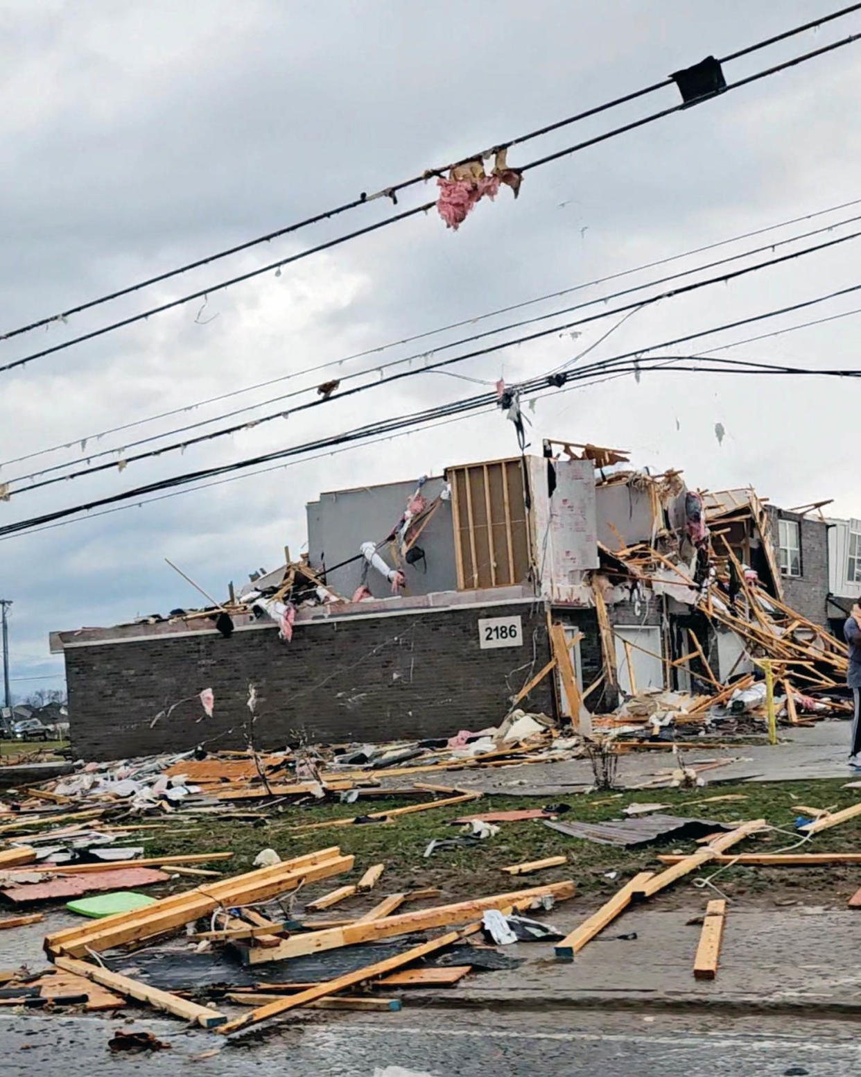 Image: Homes damaged by a possible tornado at Clarksville (Noemi Canales / Reuters)