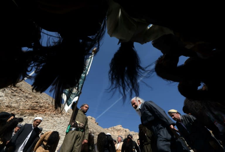 Sufi Muslims in Iraqi Kurdistan mark the birthday of the Prophet Mohammed by shaking their hair to rhythmic drumbeats