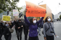 People march toward City Hall during a protest over the Memorial Day death of George Floyd, a handcuffed black man in police custody in Minneapolis, in San Francisco, Saturday, May 30, 2020. (AP Photo/Jeff Chiu)