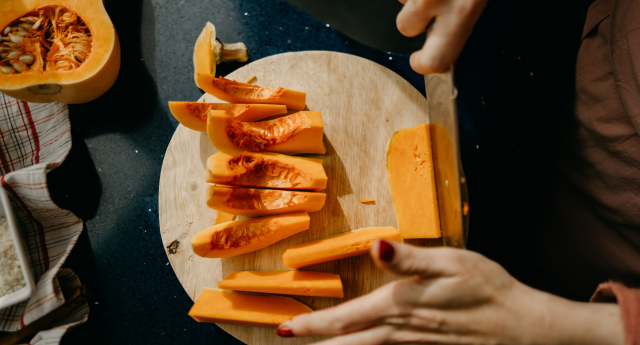 person cutting orange squash on wooden cutting board with knife, amazon canada prime early access sale knives