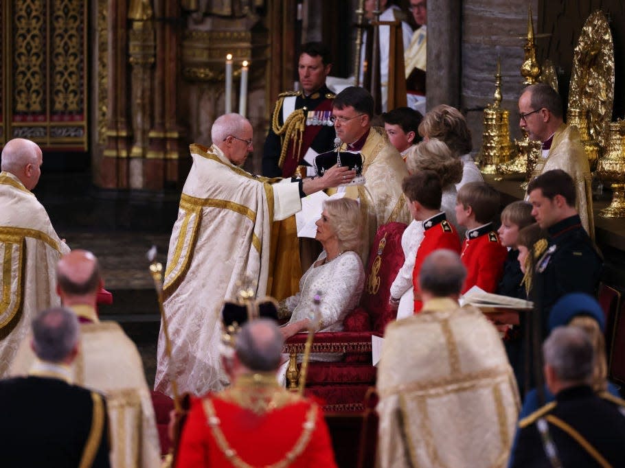 Queen Camilla is crowned by Archbishop of Canterbury Justin Welby during her coronation ceremony in Westminster Abbey, on May 6, 2023 in London, England.